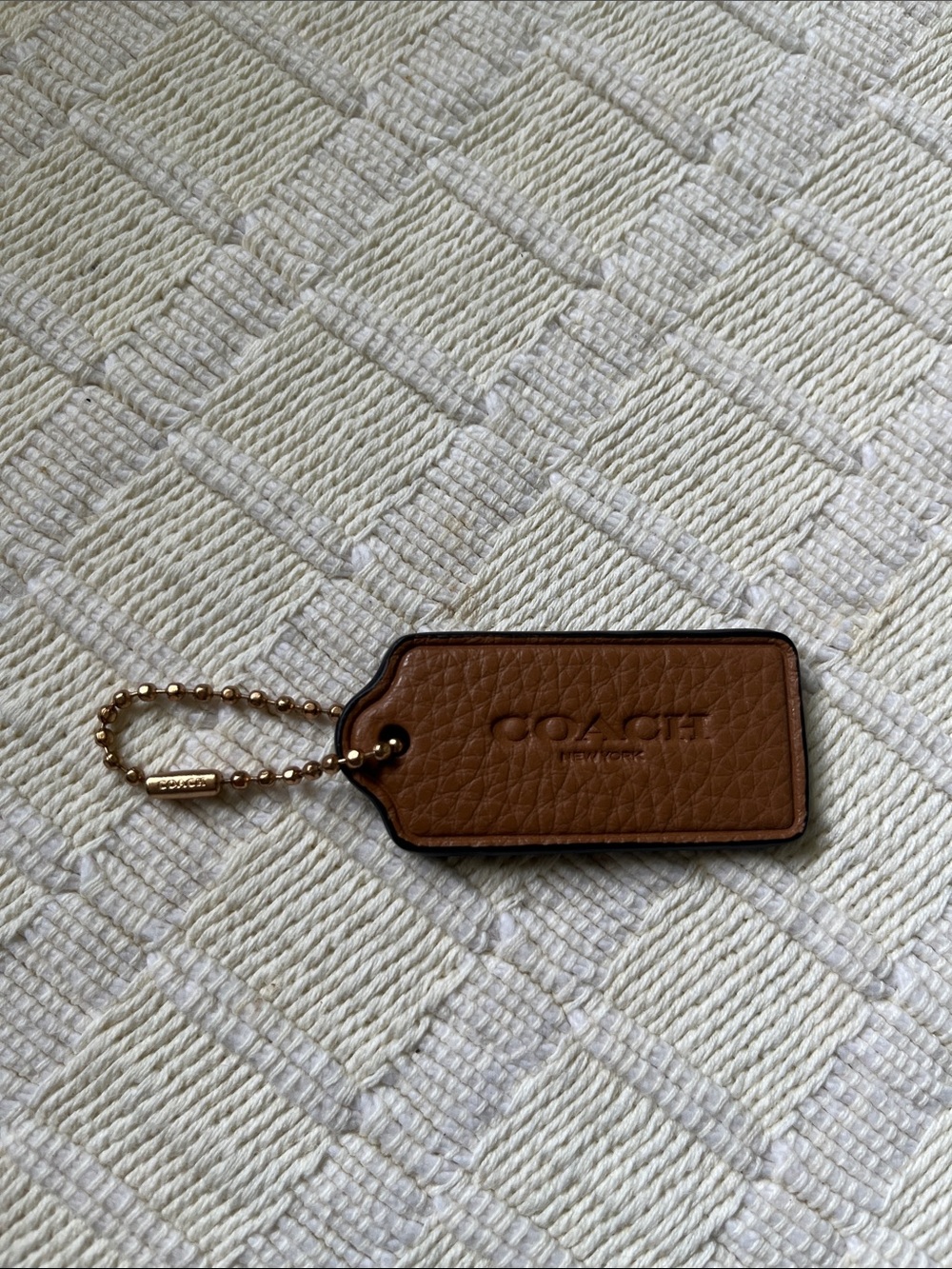 Brown Leather Coach Tag